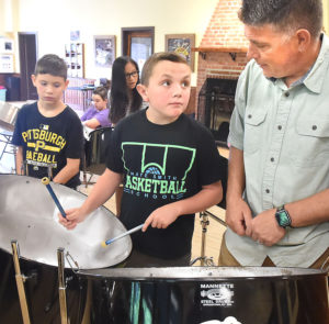 Kids participate in steel drum workshop in preparation for Friday concert